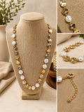 Hammered gold-tone disc accented with coin pearl details