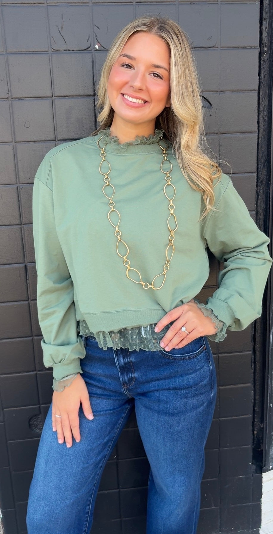 Sage green long sleeve top with ruffle details