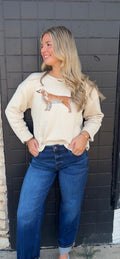 Cream sweater with dog
