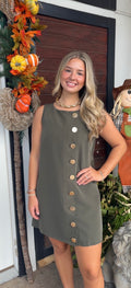 Sleeveless dress with large gold buttons